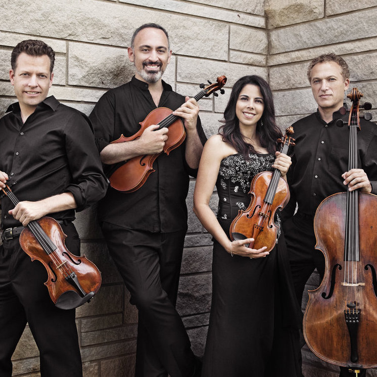 Pacifica Quartet members holding their instruments